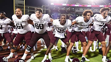 Oct 19, 2024; Starkville, Mississippi, USA; Texas A&M Aggies players react after defeating the Mississippi State Bulldogs at Davis Wade Stadium at Scott Field. Mandatory Credit: Matt Bush-Imagn Images
