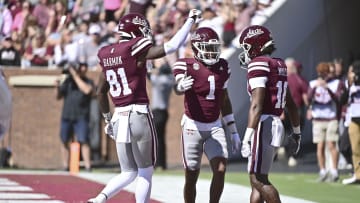 Oct 7, 2023; Starkville, Mississippi, USA; Mississippi State Bulldogs wide receiver Zavion Thomas (1) celebrates with tight end Antonio Harmon (81) and wide receiver Jordan Mosley (18) after a touchdown against the Western Michigan Broncos during the first quarter at Davis Wade Stadium at Scott Field. Mandatory Credit: Matt Bush-USA TODAY Sports