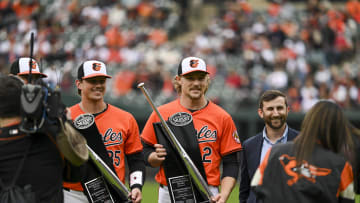 Mar 30, 2024; Baltimore, Maryland, USA;  Baltimore Orioles catcher Adley Rutschman (35) and shortstop Gunnar Henderson (2) are presented the Silver Slugger award before the game against the Los Angeles Angels at Oriole Park at Camden Yards.