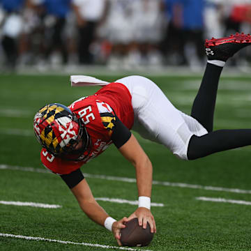 Sep 3, 2022; College Park, Maryland, USA;  Maryland Terrapins long snapper Ethan Gough (59) downs a punt on the one yard line during the second half against the Buffalo Bulls at Capital One Field at Maryland Stadium. Mandatory Credit: Tommy Gilligan-Imagn Images
