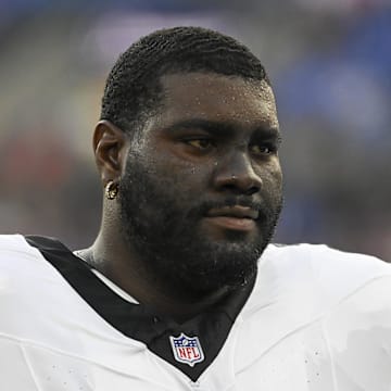 Philadelphia Eagles offensive guard Mekhi Becton (77) stands on the sidelines during the first half of a preseason game.