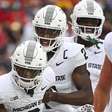 Sep 7, 2024; College Park, Maryland, USA; Michigan State Spartans wide receiver Montorie Foster Jr. (3) and quarterback Aidan Chiles (2) celebrate after a first half touchdown against the Maryland Terrapins at SECU Stadium. Mandatory Credit: Tommy Gilligan-Imagn Images