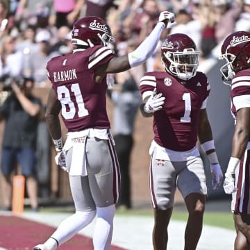 Oct 7, 2023; Starkville, Mississippi, USA; Mississippi State Bulldogs wide receiver Zavion Thomas (1) celebrates with tight end Antonio Harmon (81) and wide receiver Jordan Mosley (18) after a touchdown against the Western Michigan Broncos during the first quarter at Davis Wade Stadium at Scott Field. Mandatory Credit: Matt Bush-USA TODAY Sports