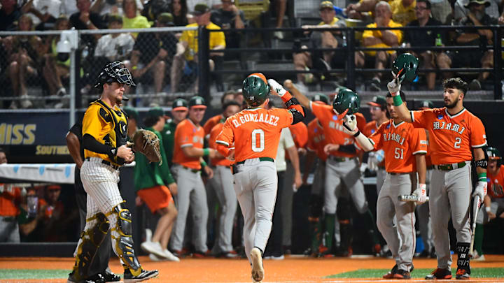 Miami Hurricanes second baseman Dorian Gonzalez, Jr. (0) scores against the Southern Miss Golden Eagles during the final game of the 2025 NCAA Hattiesburg Regional game at Pete Taylor Park in Hattiesburg, Mississippi, on June 2, 2025.