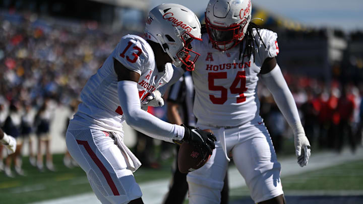 Oct 22, 2022; Annapolis, Maryland, USA;  Houston Cougars quarterback Clayton Tune (3) celebrates with Houston Cougars offensive lineman Lance Robinson (54) after scoring a second half touchdown against the Navy Midshipmen at Navy-Marine Corps Memorial Stadium. Mandatory Credit: Tommy Gilligan-USA TODAY Sports