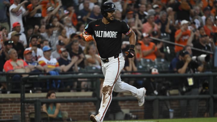 Aug 23, 2024; Baltimore, Maryland, USA;  Baltimore Orioles right fielder Anthony Santander (25) scores during the second inning against the Houston Astros at Oriole Park at Camden Yards. Mandatory Credit: Tommy Gilligan-USA TODAY Sports