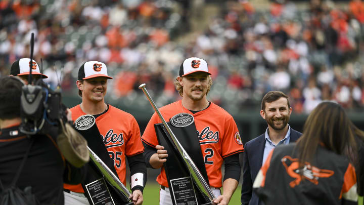 Mar 30, 2024; Baltimore, Maryland, USA;  Baltimore Orioles catcher Adley Rutschman (35) and shortstop Gunnar Henderson (2) are presented the Silver Slugger award before the game against the Los Angeles Angels at Oriole Park at Camden Yards.