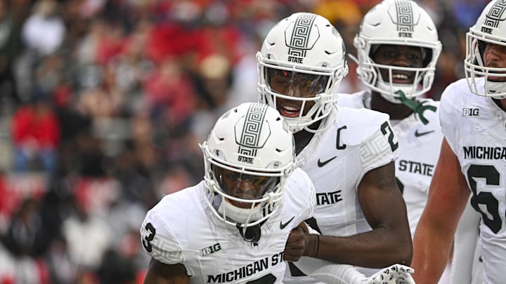 Sep 7, 2024; College Park, Maryland, USA; Michigan State Spartans wide receiver Montorie Foster Jr. (3) and quarterback Aidan Chiles (2) celebrate after a first half touchdown against the Maryland Terrapins at SECU Stadium. Mandatory Credit: Tommy Gilligan-Imagn Images