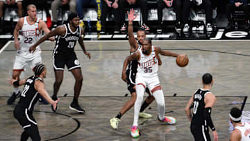 Jan 22, 2025; Brooklyn, New York, USA; Phoenix Suns forward Kevin Durant (35) looks to pass the ball as Brooklyn Nets forward Jalen Wilson (22) defends during the first half at Barclays Center. Mandatory Credit: John Jones-Imagn Images