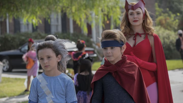 (L-R): Jett Klyne as Tommy, Julian Hilliard as Billy and Elizabeth Olsen as Wanda Maximoff in Marvel Studios' WANDAVISION exclusively on Disney+. Photo by Suzanne Tenner. ©Marvel Studios 2021. All Rights Reserved.