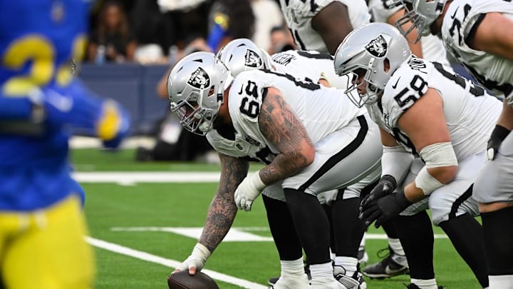 Oct 20, 2024; Inglewood, California, USA; Las Vegas Raiders center Andre James (68) and Las Vegas Raiders guard Jackson Powers-Johnson (58) driving the fourth quarter against the Los Angeles Rams at SoFi Stadium. Mandatory Credit: Robert Hanashiro-Imagn Images