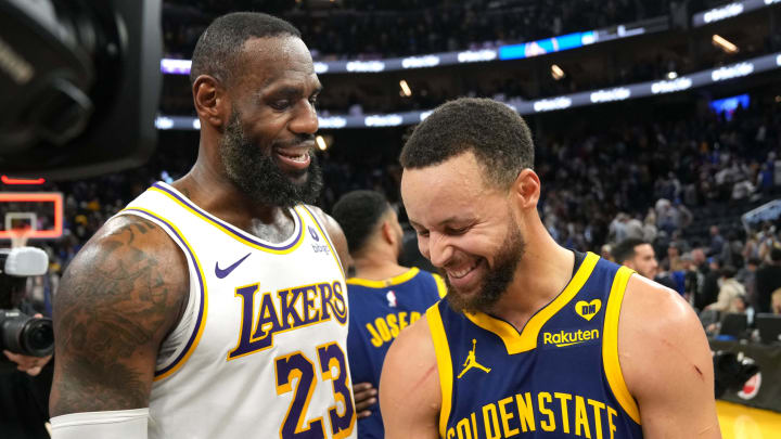 Los Angeles Lakers forward LeBron James (23) and Golden State Warriors guard Stephen Curry (right) talk after the game at Chase Center. Mandatory Credit: