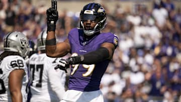 Sep 15, 2024; Baltimore, Maryland, USA;  Baltimore Ravens linebacker Odafe Oweh (99) celebrate4s after sacking Las Vegas Raiders quarterback Gardner Minshew (15) during the first quarter at M&T Bank Stadium. Mandatory Credit: Tommy Gilligan-Imagn Images