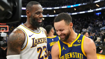 Lakers forward LeBron James and Warriors guard Steph Curry chat after a game at Chase Center.