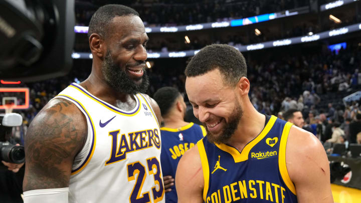 Lakers forward LeBron James and Warriors guard Steph Curry chat after a game at Chase Center.