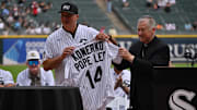 Cardinal Blase Cupich, Archbishop of Chicago gives the Chicago White Sox a jersey signed by Pope Leo XIV prior to a MLB game