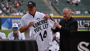Cardinal Blase Cupich, Archbishop of Chicago gives the Chicago White Sox a jersey signed by Pope Leo XIV prior to a MLB game