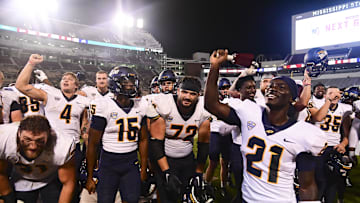 Sep 14, 2024; Starkville, Mississippi, USA; Toledo Rockets players react after defeating the Mississippi State Bulldogs at Davis Wade Stadium at Scott Field. Mandatory Credit: Matt Bush-Imagn Images