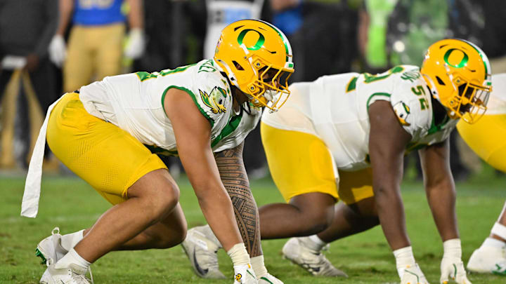 Sep 28, 2024; Pasadena, California, USA; Oregon Ducks defensive end Matayo Uiagalelei (10) and defensive lineman A'Mauri Washington (52) during the fourth quarter against the UCLA Bruins at Rose Bowl. Mandatory Credit: Robert Hanashiro-Imagn Images