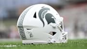 Sep 7, 2024; College Park, Maryland, USA; A detailed view of Michigan State Spartans helmet on the field before the game against the Maryland Terrapins at SECU Stadium. Mandatory Credit: Tommy Gilligan-Imagn Images