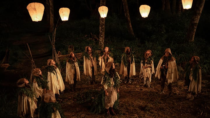 L-R: Anisa Harris as Teen Robin, Vanessa Prasad as Teen Gen, Jenna Burgess as Teen Melissa, Sophie Nélisse as Teen Shauna, Jasmin Savoy Brown as Teen Taissa, Liv Hewson as Teen Van, Courtney Eaton as Teen Lottie, Nia Sondaya as Teen Akilah, Samantha Hanratty as Teen Misty, Kevin Alves as Teen Travis and Silvana Estifanos as Teen Britt in Yellowjackets, episode 1, season 3, streaming on Paramount+ with SHOWTIME, 2025. 