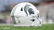 Sep 7, 2024; College Park, Maryland, USA; A detailed view of Michigan State Spartans helmet on the field before the game against the Maryland Terrapins at SECU Stadium. Mandatory Credit: Tommy Gilligan-Imagn Images