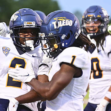 Toledo Rockets wide receiver Junior Vandeross III (2) reacts with Toledo Rockets wide receiver Jerjuan Newton (1) after a touchdown against Mississippi State Bulldogs during the first quarter at Davis Wade Stadium at Scott Field.