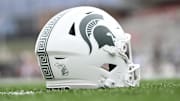Sep 7, 2024; College Park, Maryland, USA; A detailed view of Michigan State Spartans helmet on the field before the game against the Maryland Terrapins at SECU Stadium. Mandatory Credit: Tommy Gilligan-Imagn Images