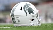 Sep 7, 2024; College Park, Maryland, USA; A detailed view of Michigan State Spartans helmet on the field before the game against the Maryland Terrapins at SECU Stadium. Mandatory Credit: Tommy Gilligan-Imagn Images