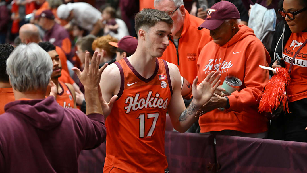 Feb 21, 2026; Blacksburg, Virginia, USA;  Virginia Tech Hokies guard Neoklis Avdalas (17) celebrates with fans after the game at Cassell Coliseum. Mandatory Credit: Brian Bishop-Imagn Images