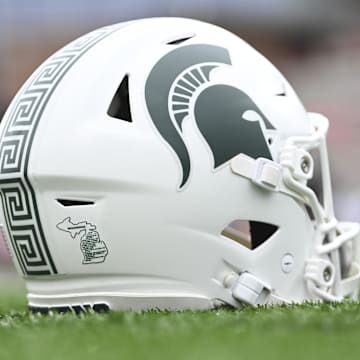 Sep 7, 2024; College Park, Maryland, USA; A detailed view of Michigan State Spartans helmet on the field before the game against the Maryland Terrapins at SECU Stadium. Mandatory Credit: Tommy Gilligan-Imagn Images