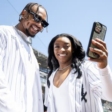 Bears safety Jonathan Owens and his wife, USA Olympic gymnast Simone Biles, are honored pregame at a White Sox-Reds game. 
