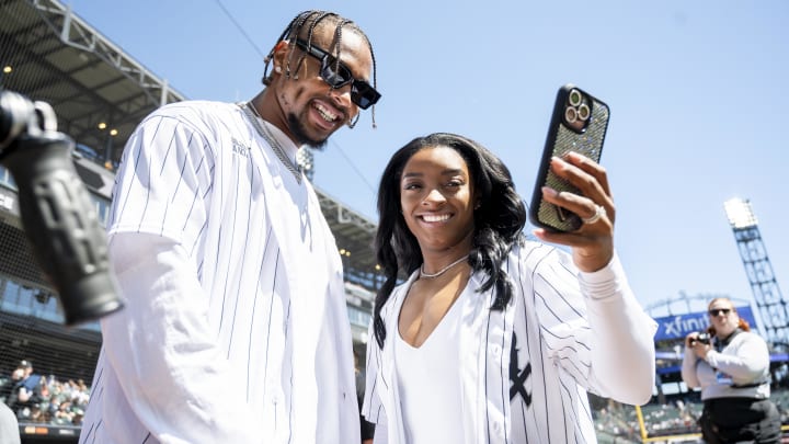 Bears safety Jonathan Owens and his wife, USA Olympic gymnast Simone Biles, are honored pregame at a White Sox-Reds game. 