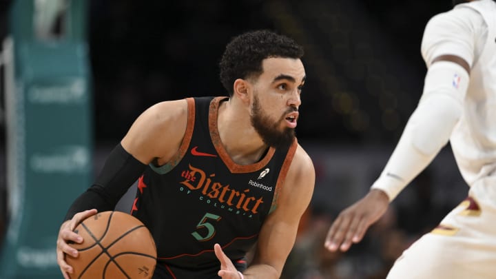 Feb 25, 2024; Washington, District of Columbia, USA; Washington Wizards guard Tyus Jones (5) dribbles as Cleveland Cavaliers guard Darius Garland (10) defends  during the second  half at Capital One Arena. Mandatory Credit: Tommy Gilligan-USA TODAY Sports