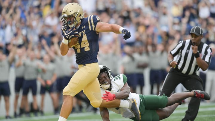 Sep 9, 2023; Annapolis, Maryland, USA; Navy Midshipmen linebacker Colin Ramos (44) returns a fumble return as Wagner Seahawks running back Rickey Spruill (36) divers to tackle during the first half  at Navy-Marine Corps Memorial Stadium. Mandatory Credit: Tommy Gilligan-USA TODAY Sports