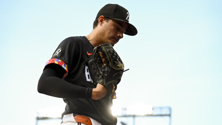 Jun 29, 2024; Baltimore, Maryland, USA;  Baltimore Orioles pitcher Cade Povich (37) walks to the dugout during the first inning against the Texas Rangers at Oriole Park at Camden Yards.