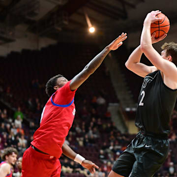 Feb 5, 2025; Virginia Tech guard Jaden Schutt (2) shoots a shot as SMU guard Chuck Harris (3) defends.