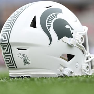Sep 7, 2024; College Park, Maryland, USA; A detailed view of Michigan State Spartans helmet on the field before the game against the Maryland Terrapins at SECU Stadium. Mandatory Credit: Tommy Gilligan-Imagn Images