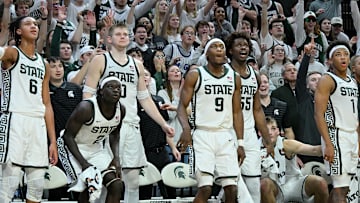 Nov 21, 2025; East Lansing, Michigan, USA;  The Michigan State Spartan bench reacts against the Detroit Mercy Titans at the end of the game at Jack Breslin Student Events Center. Mandatory Credit: Dale Young-Imagn Images