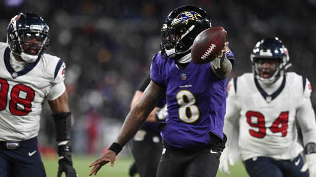 Baltimore Ravens quarterback Lamar Jackson runs for a touchdown against the Houston Texans