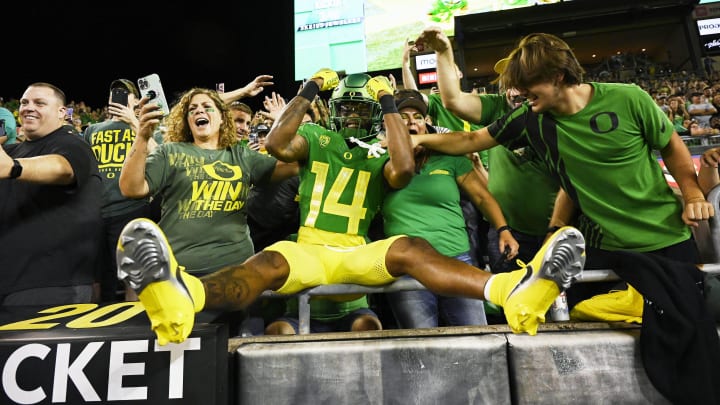 Oct 1, 2022; Eugene, Oregon, USA; Oregon Ducks wide receiver Justius Lowe (14) celebrates with fans before a game against the Stanford Cardinal at Autzen Stadium. The Ducks won the game 45-27.