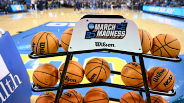 Feb 5, 2025; Los Angeles, California, USA; A rack of basketballs with the March Madness logo before that start of the UCLA Bruins - Ohio State Buckeyes game at Pauley Pavilion presented by Wescom. Mandatory Credit: Robert Hanashiro-Imagn Images