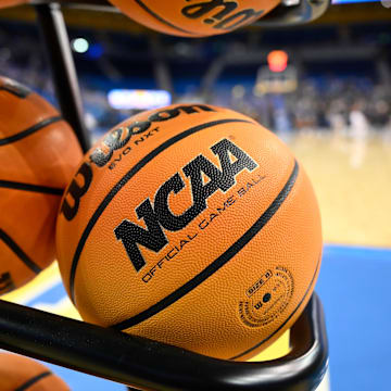 Another player has been identified as a person of interest in college basketball’s wide-ranging investigation into alleged game fixing and performance manipulation. 
