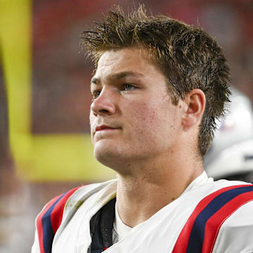 Aug 25, 2024; Landover, Maryland, USA;  New England Patriots quarterback Drake Maye (10) stands on the sidelines during the first half against the Washington Commanders at Commanders Field. Mandatory Credit: Tommy Gilligan-Imagn Images