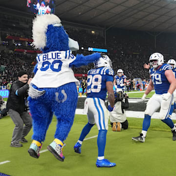 Nov 9, 2025; Berlin, Germany; Indianapolis Colts running back Jonathan Taylor (28) celebrates with teammates and mascot after a touchdown against the Atlanta Falcons during the NFL Berlin Game at Olympic Stadium. 