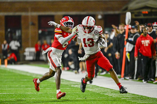 Nebraska Cornhuskers wide receiver Nyziah Hunter (13) runs for a first down 