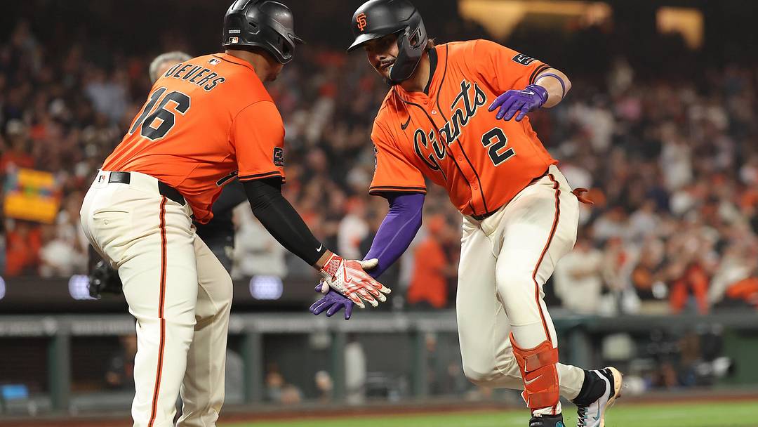 Sep 26, 2025; San Francisco, California, USA; San Francisco Giants shortstop Willy Adames (2) high fives designated hitter Rafael Devers (16) after batting him in on a two-run home run against the Colorado Rockies during the first inning at Oracle Park. Mandatory Credit: Kelley L Cox-Imagn Images