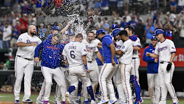 Texas Rangers designated hitter Josh Jung (6) celebrates with his teammates after he hits a walk-off home run. Mandatory Credit: Jerome Miron-Imagn Images