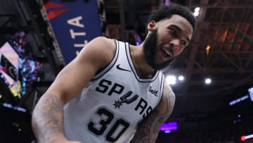 Mar 27, 2024; Salt Lake City, Utah, USA; San Antonio Spurs forward Julian Champagnie (30) reacts to a play against the Utah Jazz during the second quarter at Delta Center. 