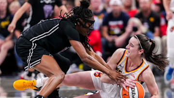 Golden State Valkyries guard Tiffany Hayes (15) and Indiana Fever guard Caitlin Clark (22) fight for the ball Wednesday, July 9, 2025, during a game between the Indiana Fever and the Golden State Valkyries at Gainbridge Fieldhouse in Indianapolis.